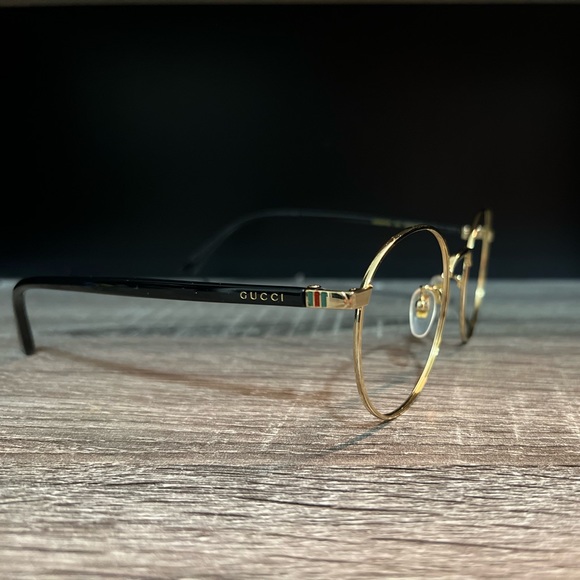 Gucci glasses frames; Unisex; Black and gold